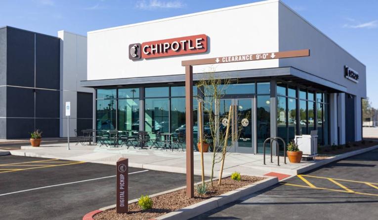 Chipotle exterior of a restaurant with a drive-thru.