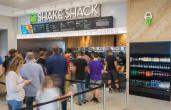 Customers line up at a Shake Shack airport location.