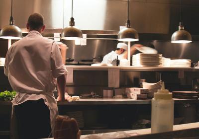 Workers in a restaurant kitchen