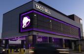 Taco Bell Defy restaurant at dusk.