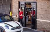 Quick-service employees using ASSA ABLOY drive-thru door